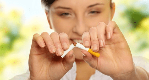 girl breaks a cigarette and gets rid of addiction