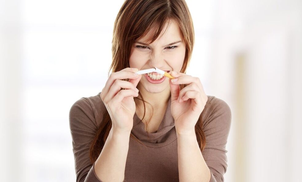 girl breaks a cigarette and quits smoking photo 1