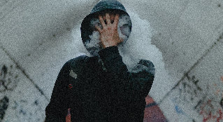 In the smoke from cigarettes